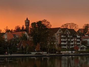 Buildings against sky during sunset