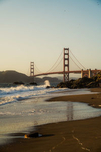 View of suspension bridge at sunset