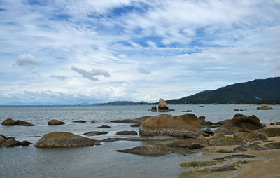 Scenic view of sea against cloudy sky