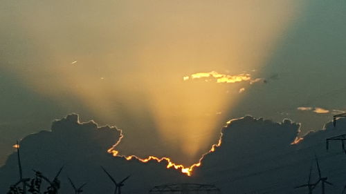 Close-up of silhouette water against sky at sunset