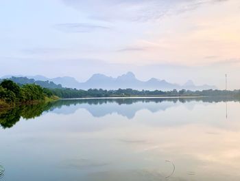 Scenic view of lake against sky during sunset