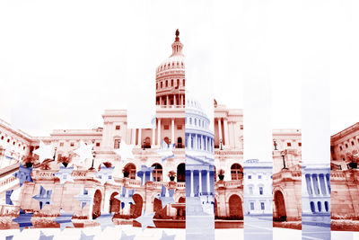 Buildings in city against clear sky