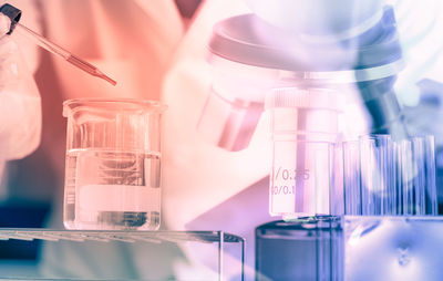 Digital composite image of scientist working in laboratory
