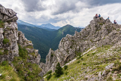 People on rocky peak