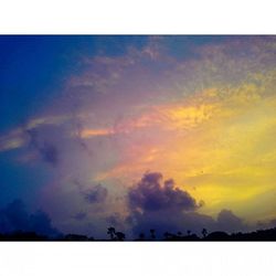 Scenic view of cloudy sky at sunset