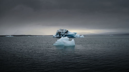 Scenic view of sea against sky during winter