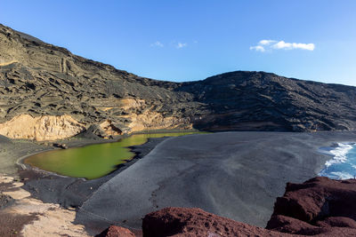 Lagoon with green water - lago verde - nearby el golfo on canary island lanzarote, spain