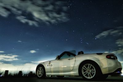 Vintage car against sky at night