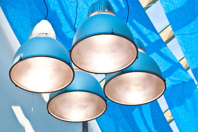 Low angle view of illuminated lighting equipment