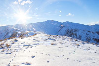 Scenic view of snowcapped mountains against sky