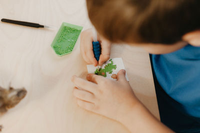 High angle view of baby holding hands