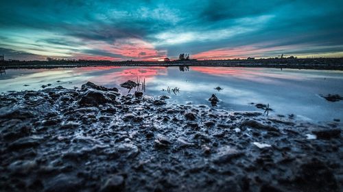 Scenic view of sea against sky at sunset
