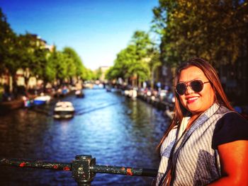 Portrait of smiling woman in boat at canal