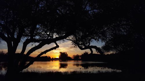 Scenic view of lake at sunset