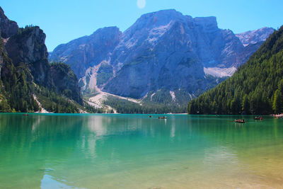 Scenic view of lake and mountains against sky