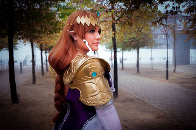 Side view of thoughtful woman in cosplay costume