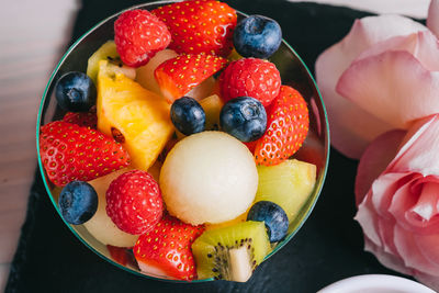 High angle view of strawberries in bowl on table