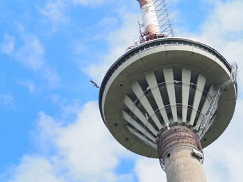 Low angle view of tower against cloudy sky