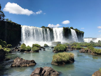 Scenic view of waterfall against sky, cataratas do iguaçu, brazil, argentina 