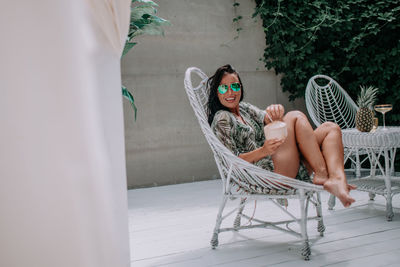 Woman sitting on chair