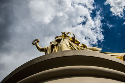 Low angle view of statue against cloudy sky