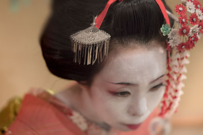 Close-up portrait of girl looking down