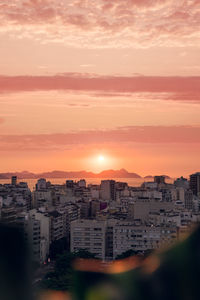 Cityscape against sky during sunset