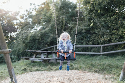 Portrait of boy holding playground