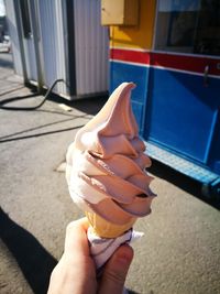 Hand holding ice cream cone