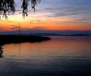 Scenic view of calm sea at sunset