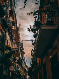 Low angle view of illuminated buildings against sky