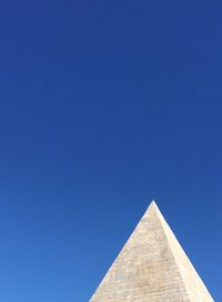 Low angle view of built structure against blue sky