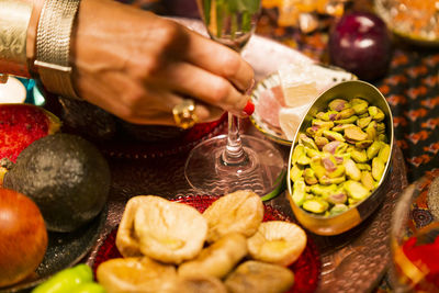 Midsection of person preparing food on table