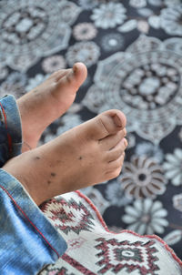 Low section of person holding hands