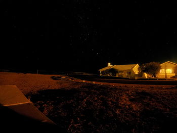 Scenic view of farm against sky at night