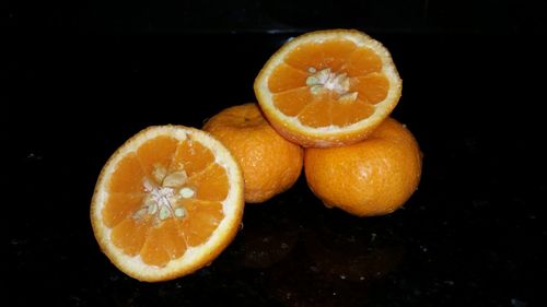 Close-up of lemon slice on black background