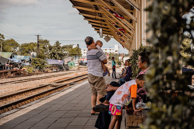 People at railroad station