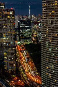 High angle view of illuminated buildings in city at night