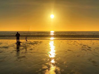 Fisherman on a welsh beach.