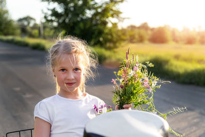 Portrait of girl with pink flower