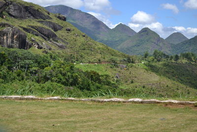 Scenic view of landscape and mountains against sky