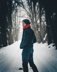 Woman standing in snow