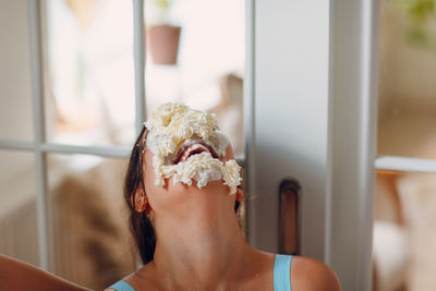 Portrait of woman holding ice cream