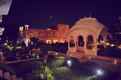 Facade of temple against sky at night