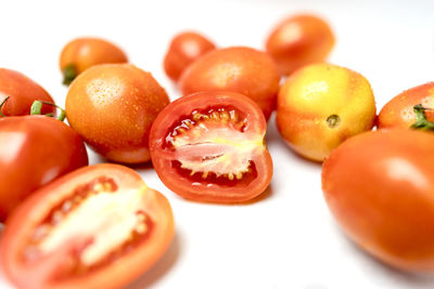 Close-up of tomatoes against white background