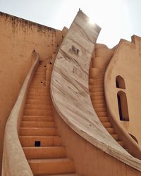 Low angle view of steps and building with beautiful curves at jantar mantar jaipur