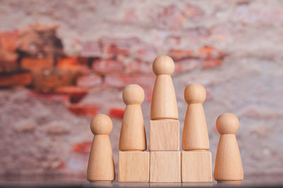 Close-up of figurine on wood