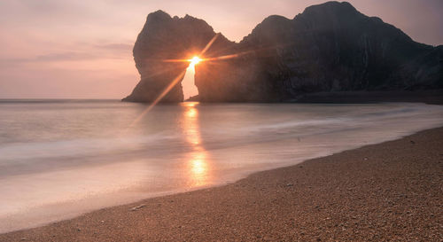 Scenic view of sea against sky during sunset