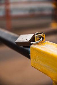 Close-up of padlock on railing