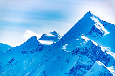 Scenic view of snowcapped mountain against sky